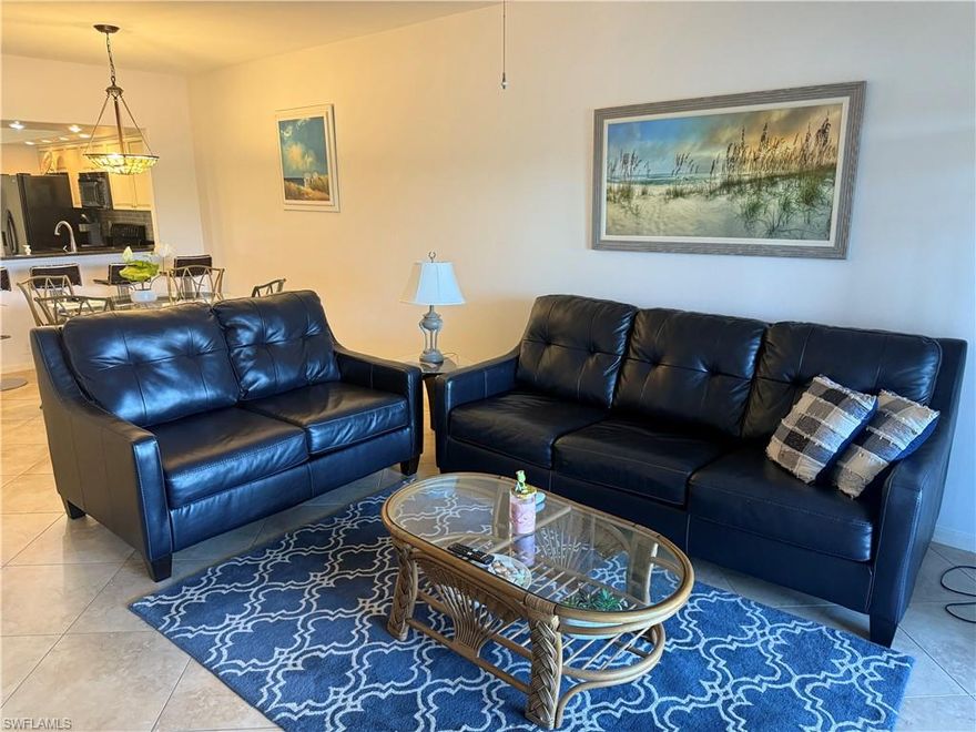 Beautiful 1st-floor turnkey condo with bundled golf in Worthington Country Club! Featuring a spacious floor plan, this home includes new coastal furnishings, couches, living room, bedrooms, etc!  Updated 2 bedrooms and 2 full baths including a spacious primary suite with an en-suite bath. The kitchen is equipped with a breakfast bar, eat-in dining area, and generous storage, perfect for both everyday meals and hosting guests. Two sets of sliding glass doors open to a screened lanai showcasing stunning lake views, creating an inviting space to relax and enjoy the natural surroundings. Nestled within Worthington, a premier gated golf community, residents enjoy access to exceptional amenities, including a clubhouse, sparkling pool and spa, fitness center, tennis courts, bocce, on-site dining, library, putting green, and an 18-hole championship golf course. Located in a prime Bonita Springs location just off Bonita Beach Road, you’re only minutes from Barefoot Beach, top-rated dining, shopping, and entertainment. Experience the best of Southwest Florida living in this move-in-ready gem — a perfect seasonal getaway or year-round home!