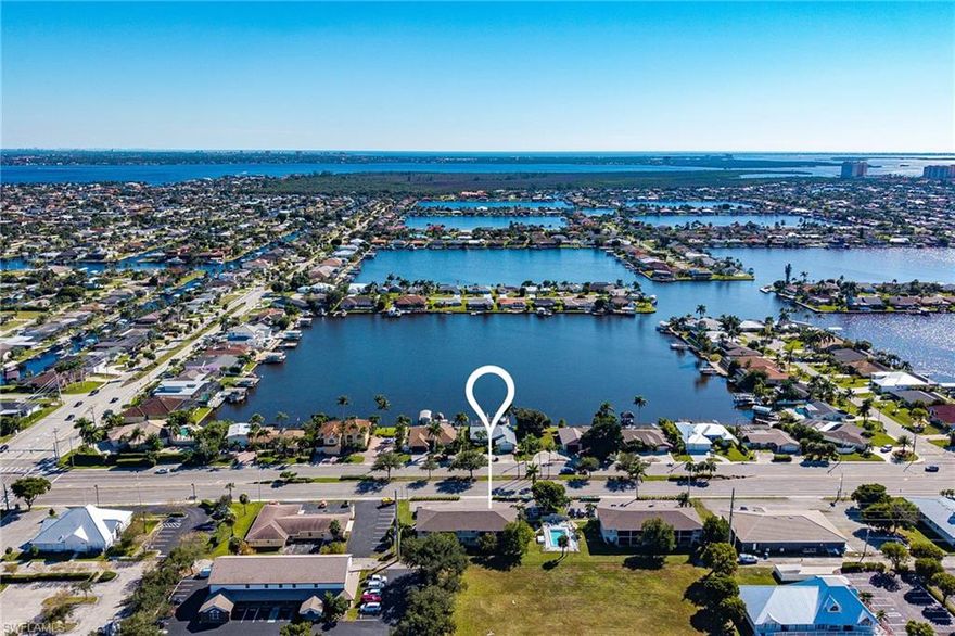 Lock-and-leave ease in a prime Cape Coral location, ideal as a vacation escape, full-time residence, or income-producing investment. This spacious 2-bed, 2-bath second-floor end unit sits in a well-kept community just minutes from Downtown Cape Coral. Inside, an open great-room layout is filled with natural light; the kitchen features stainless appliances and ample cabinetry and flows to a private screened balcony, perfect for morning coffee or cocktails in the Florida breeze. The primary suite offers a large walk-in closet, while the guest bedroom doubles nicely as a home office. Practical perks include in-unit laundry, an assigned parking space, and a community pool only steps from your door. With shopping, dining, and entertainment close by and quick access over the Cape Coral Bridge to Fort Myers beaches. This condo checks every box for lifestyle and convenience.