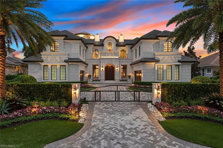 A masterfully crafted custom waterfront residence located within minutes of the best Naples has to offer. This home exudes timeless elegance with exquisite attention to detail like its soaring living room and rotunda which both feature gold leafing on the ceilings, Italian crystal lighting, lavish furnishings, custom ceiling designs in every room, a stunning 600-bottle climate-controlled wine vault, a beautifully appointed kitchen featuring a 12-foot island and a smart home system that controls music, lighting, window shades and much more. The expansive floor plan wonderfully showcases the meticulously designed spaces such as a 4-car garage and elevator, 4 en-suite guest bedrooms with elegant finishes, a private study, a second-floor lounge with custom wet bar and the incredible master suite which features a fireplace, dual bathrooms and dual master closets which will truly impress. The coral-stone lanai, pool deck and dock are perfect for entertaining with automated shutters, awnings and screens, an outdoor kitchen, infinity saltwater pool/spa and 3 fire features. This one-of-a-kind home was lovingly built, designed with every detail in mind and is ready to impress.