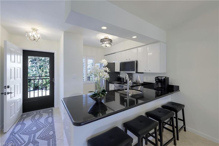 CLEAN!! BEAUTIFUL!! and QUIET!! This pet friendly condo comes with granite kitchen countertops and ALL BRAND NEW APPLICANCES: refrigerator, range, dishwasher, microwave, washer and dryer. Freshly painted with new light fixtures, receptacles, switches and high end furnishings. Whether you are sitting in this beautifully decorated living room or on the private lanai you will be viewing Floridas gorgeous green landscape with the pool off in the distance.  This second floor unit ceiling is vaulted, impact windows with plantations shutters and closets that have new organizer shelving. Washer and dryer in unit. All new paved asphalt parking lot. Located in a highly desirable area with popular shops and restaurants close by, such as Esplanade, Dolphin Tiki, Snook Inn and Rose Marina, you won't want to miss this opportunity!