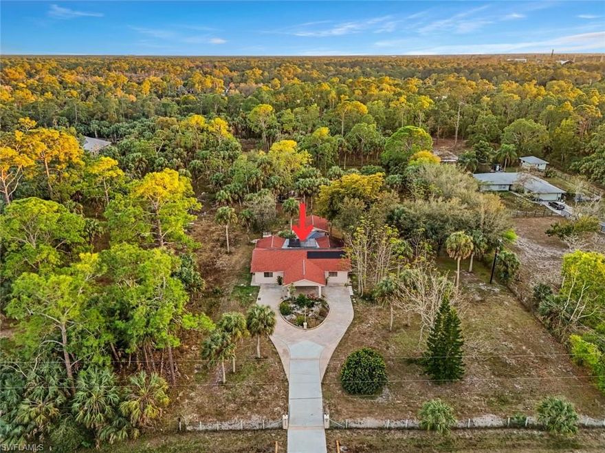 LOCATION, LOCATION, LOCATION! Live the Golden Gate Estates life, not far from Collier Blvd. Welcome to your own private retreat nestled in the heart of sought-after Weber Woods, on 2.5 acres. This 4-bedroom, 3-bath home blends charm, flexibility and wide-open space—perfect for multi-generational living, hosting guests.
Boasting two spacious primary suites, a family room, formal living and dining spaces, and a kitchen with dual eat-in areas—made for both everyday living and memorable gatherings. Thoughtful upgrades bring peace of mind, including a 2018 roof, 5-ton A/C unit, tankless water heater and updated attic insulation for energy efficiency. Your 2.5-acre tropical oasis, featuring mature fruit trees (mango, lychee, sour orange and lima orange), multiple tool sheds, chicken coops, an air compressor and grinder, plus full irrigation with a dedicated pump, ideal for hobbyists, gardeners or those craving a true country-style lifestyle. Bonus opportunity: a separate building adjacent to the home offers endless possibilities: guest quarters, home office, workshop or future rental potential. A small kitchen is in the enclosed structure. All of this, just minutes from everyday conveniences including Publix, gas stations, parks, schools, gyms and playgrounds nearby, give the perfect balance of privacy and accessibility. Properties like this rarely come available in Weber Woods. Don’t miss your chance to own a one-of-a-kind slice of paradise.