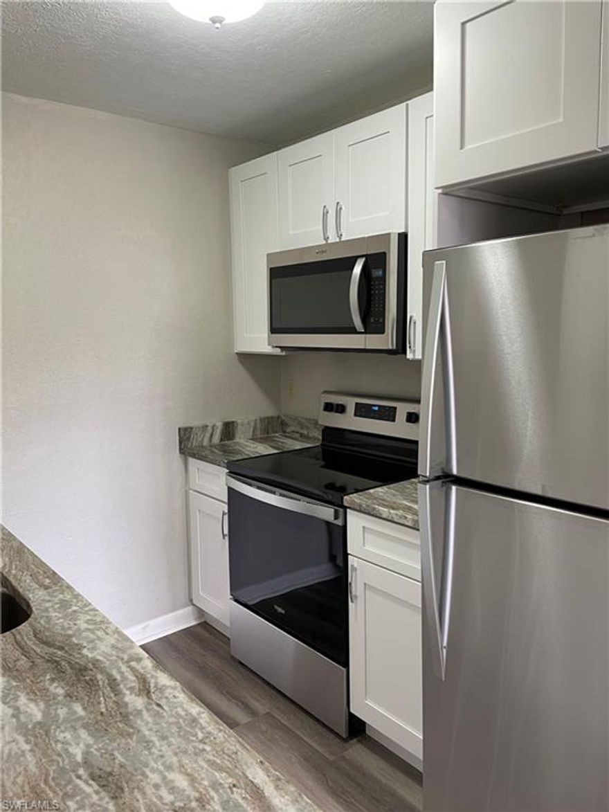 Location, Location! Enjoy the convenience of this fast growing Bayshore Art District. Walking distance to great restaurants, Celebration Park, Botanical Gardens and just minutes to 5th Ave and the beaches. This 2 bedroom, 2 bathroom, 2nd floor condo has been beautifully updated in 2022 with Craftsman cabinets, stainless appliances, quartz countertops, luxury vinyl flooring and new carpets. AC new in 2022. One of only a few condos in Abaco that overlooks the lake.  Move in ready!