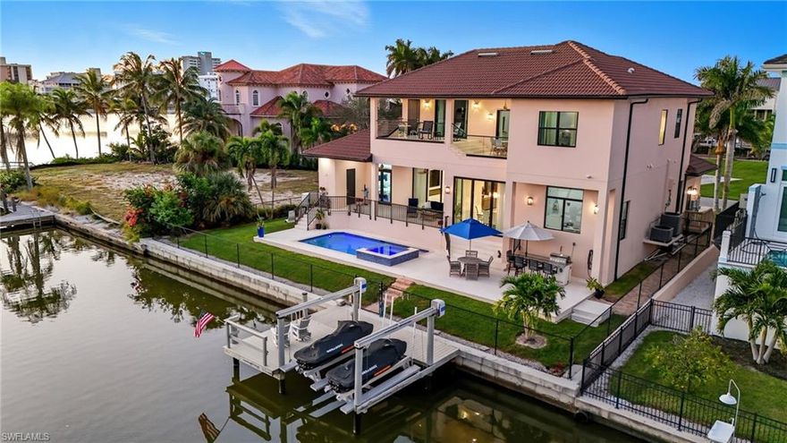 Ultra- Luxury Waterfront Direct Gulf Access Estate in The Conners- Naples, FL. Experience next-level coastal living in this brand-new construction waterfront estate, perfectly positioned in the prestigious Conners neighborhood of Naples. Boasting 4 bedrooms plus a den, 6 spa-inspired bathrooms, and 4,647 square feet of masterfully designed living space, this home defines modern elegance and effortless luxury. Step through the grand entryways into soaring open-concept interiors where natural light pours in through expansive glass, framing breathtaking water views from nearly every room. The gourmet kitchen, designer appointed living spaces, and seamless indoor-outdoor transitions make entertaining a dream. Outside, your private oasis awaits- featuring a custom saltwater pool, integrated spa, and spacious waterfront terrace perfect for sunset gatherings or quiet mornings by the water. With direct Gulf access and a prime canal-front location, this is boating lifestyle at its finest, This estate is not just a home- it's a statement. A rare opportunity to own a piece of paradise in one of Naples' most exclusive waterfront enclaves. Enjoy the beach lifestyle.