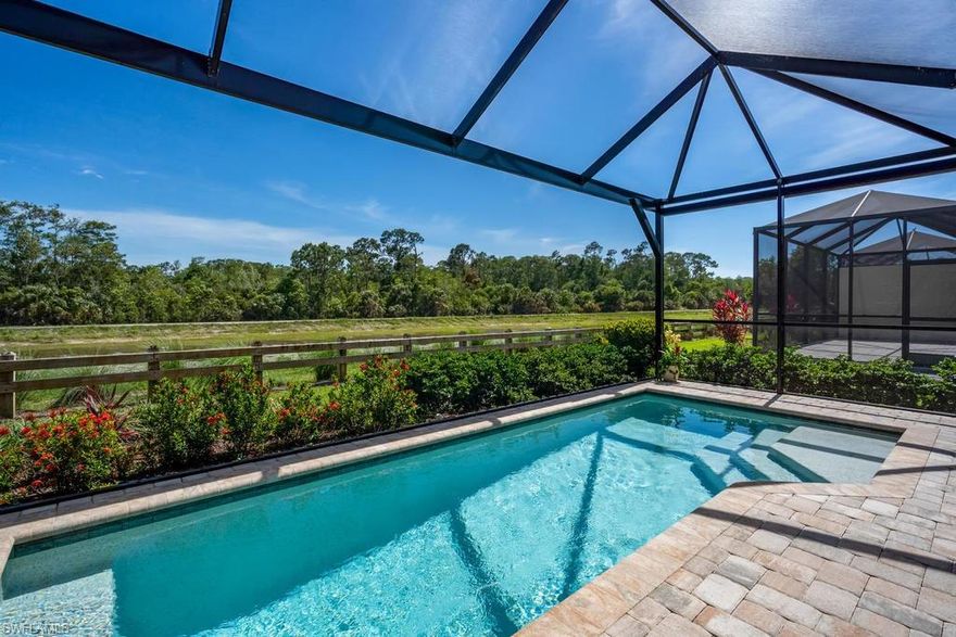 You’ll want to view the video and virtual tour of this Isles of Collier Preserve home with sunny South views overlooking the water and natural wooded area first. From the moment you enter the foyer you'll be greeted by the beautiful great room with high ceilings and soft, muted color palette. And just beyond the screened lanai and heated pool offering casual Florida living. This home has many upgrades and features and is ready for immediate occupancy! The Isles of Collier Preserve offers an array of recreation and entertainment amenities and is sure to please everyone.   Enjoy the expansive clubhouse, large pool, exercise facilities and indoor/outdoor dining options, tennis and basketball courts and check out the boating opportunities. Minutes to Olde Naples, the sugar sand Gulf of Mexico beaches, The Naples Philharmonic, fine dining, entertainment, shopping and boating!  Ask about special financing options also available.