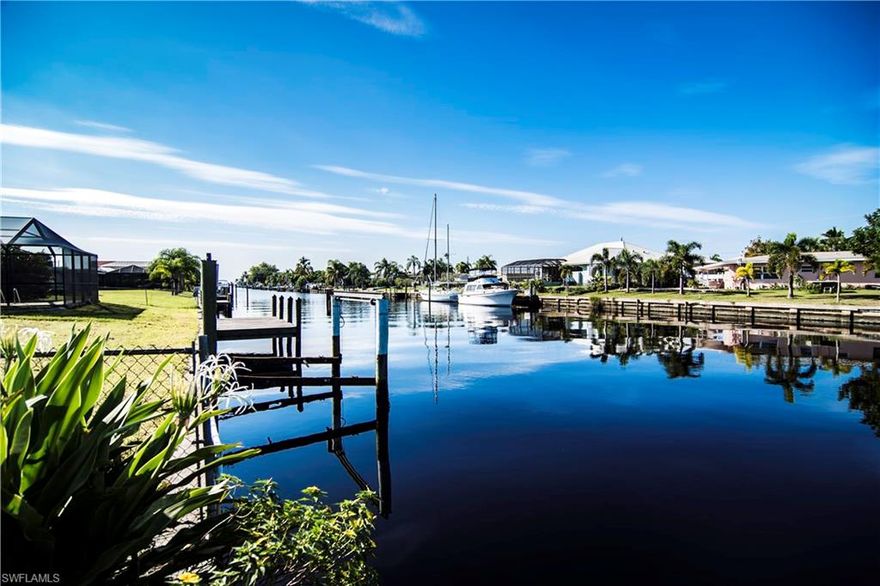 Newer Custom Built Home on Oversize Lot and 100' Wide Sailboat Canal 5 Minutes to Open Water with Beautiful Heated Pool. Walk in the beautiful double door entry to a view of the pool and wide canal. This home is light, Bright and Airy, ready for your Florida Lifestyle Decor! Split floor plan, cathedral ceiling, formal dining room, living room, and family room. Kitchen with breakfast bar, dining nook and aquarium window overlooking the pool. Large Master bedroom with private bath including walk-in closets, dual sinks, garden tub and walk-in shower. Large heated pool and screened Lanai. Double door foyer entry, plant shelves, rounded corners, and sliders from Master, Living Room and Family Room. 2nd Master Bedroom bath is also the pool bath. This is the perfect home for your Florida Lifestyle.