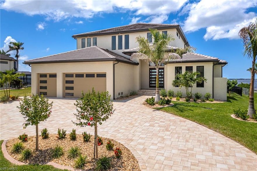 Location, Location, Location!!
Elegant, Modern, Welcoming, Coastal Contemporary New Construction 2-Story Estate Home located on Dolphin Drive.
Dolphin Dr is one of the few Streets in Cape Coral overlooking the widest portion of the River with Southern Exposure and the only Street this close to the Beach and upcoming Restaurants and Yacht Club
Southwestern rear Exposure for this Home offering the most daytime Sunlight and outstanding Sunsets across Miles of open Water! 
This custom built 2-Story Home features unobstructed Views, an open and very modern Floor Plan with lots of natural Light.
24ft wide double pocketing sliding Glass Doors for opening your Indoor Living Area to the Outdoor Lanai and stunning oversized Pool with Spa. This Home features 5 Bedrooms and 4.5 Bathrooms, 12 ft first Floor Ceilings and 10 ft Second Floor Ceilings.
10ft brand-new Seawall. Gorgeous new 100 Foot Dock w/seating Area and Sun Deck along with a 16,000 lb. Boat Lift.