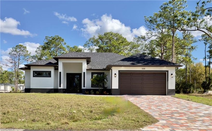 **New Construction on Half-Acre Lot!** 

This stunning 3-bedroom, 2-bathroom home features a den/office, perfect for those who work from home, and a 2-car garage. It's located in a peaceful residential area that strikes a balance between privacy and convenience. 

Upon entering, you will be welcomed by a double-door entryway and tile flooring throughout the home. The open-concept layout enhances the spacious feel, while the high-end custom kitchen boasts a large island and elegant quartz countertops. 

The master bedroom includes expansive his-and-hers walk-in closets, dual sinks, and a separate walk-in shower stall. For added safety, the home is equipped with hurricane-impact windows and doors. 

Step outside to a covered terrace that offers plenty of space for you to create your dream pool in the expansive lot. The property has been intentionally designed with one side of the lot providing extra space for anyone looking to bring in a truck or a boat. 

Situated in the heart of Lehigh Acres, this home is conveniently close to restaurants, schools, and shopping. Don’t miss this rare opportunity to enjoy space, comfort, and modern convenience all in one place!