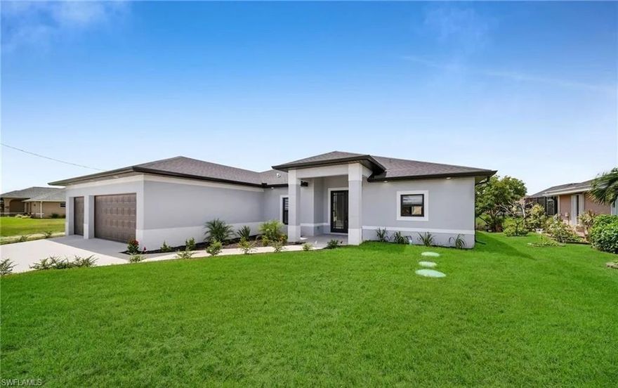 Beautiful new construction (2024) home will not last long! This stunning property is the perfect blend of modern luxury with natural beauty. Located in a peaceful neighborhood close to schools, restaurants, and shopping! This home is situated pon a beautiful waterfront lot, it offers serene views of a beautiful canal and lush mangroves, ideal for those who appreciate tranquility and nature. This spacious home includes three bedrooms, two bathrooms, and an additional office space that can be considered a 4th bedroom as well, perfect for working from home or as a quiet retreat. The interior features elegant porcelain tile floors throughout, providing a sleek and sophisticated look that’s also easy to maintain. The kitchen is a chef’s dream, boasting quartz countertops and beautiful 42-inch cabinets that offer ample storage and a touch of elegance. The home is designed to maximize natural light, with double doors that open to the picturesque surroundings. The master suite features his and hers closets and sinks, adding a touch of luxury and convenience. The 3-car garage comes with a durable epoxy floor, ensuring a clean and polished space for your vehicles and storage needs. The high ceilings throughout the home create an open and airy atmosphere, enhancing the overall sense of space and comfort. Enjoy a spacious open lanai with epoxy flooring overlooking Cape Coral’s stunning waterfront sceneries , with plenty of room to add a pool, making it perfect for outdoor entertaining and relaxation.  Impact resistant windows & doors all throughout the property. Spacious laundry room (Washer & Dryer included). NOT IN A FLOOD ZONE, NO HOA.