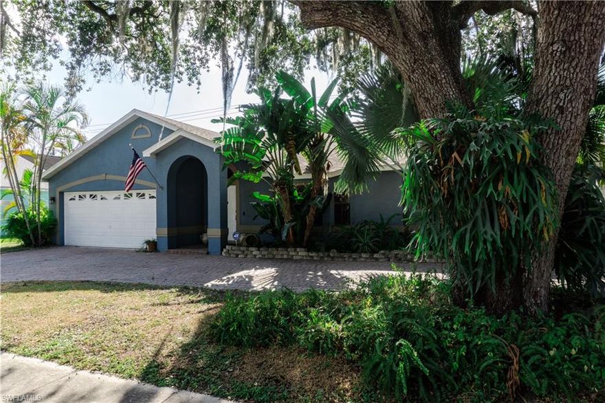 Come see this gorgeous 3 bedroom 2 bath home located right off McGregor Blvd, just minutes from the Fort Myers Country Club.  This home is surrounded by beautiful mature trees and features a great open floor plan with vaulted ceilings throughout. With the master suite on one side and two spacious bedrooms on the other, there is plenty of privacy and room to spread out.  There is even a cozy lanai right off the master bedroom.  The kitchen has been completely updated and a nice size family room and office were also added.  The private, back yard is fabulous - complete with firepit. The home has a brand new electric panel, updated roof and the A/C is two years old.  This home is truly move-in ready.  There is even a circular driveway for all your guests.  Please make an appointment today to see this beautiful home for yourself.