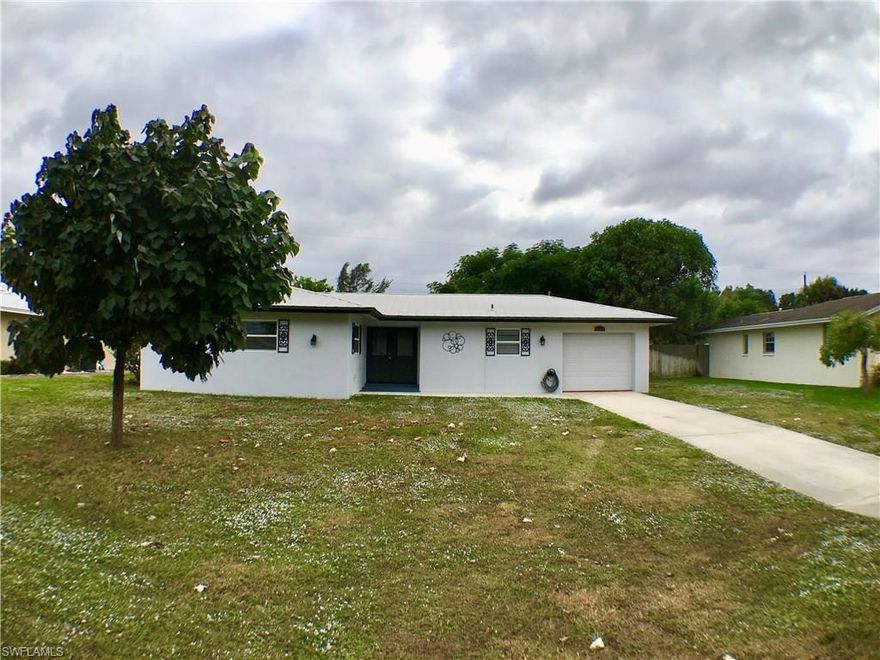 Why rent when you can own! Ready to move in, nice starter home..this cozy single family home is in great condition with 2 bedrooms, 1 large bath and 1 car attached garage, nice kitchen upgrades new tile floor and cabinets,stainless steel appliances. Double impact sliding door and steel galvanized roof, huge back yard allows you to enjoy the outdoors. This property is on CITY WATER & CITY SEWER!!! No HOA fees...It won't last long..Call now to see it! 239-438-0910