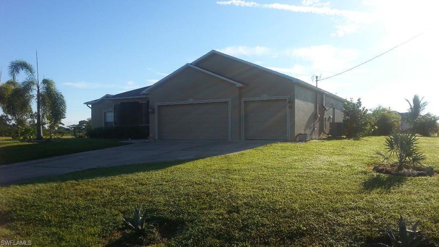 Motivated Seller with beautiful 4/3/3 home in a quiet neighborhood. The home has stainless appliances, level four granite counter tops, real wood cabinets, gorgeous custom salt water pool (sophisticated system) with water feature, outside kitchen equipment for your cookout pleasure, pool bath, security system monitored currently, fruit trees galore, small raised garden area for those with a green thumb on a triple lot with no neighbors currently. This home has it all and located also close to many activities - across the street from a fresh water canal and close to numerous activities to make this home your very own paradise in SWFL either to relax and enjoy your retirement or raise a family. The future of this home has a lot of fruit to bear with: 2 Avacado Trees - 2 Banana - Mango - 2 Papaya - Star fruit - Tangelo - Loquat - 2 Coconut Palms - Valencia Orange Tree - Lemon Tree - Lime Tree - these plants all take time to nurture and grow but have a good start to providing jams and many meals of enjoyment and still a small manageable garden for growing food year round. Triple garage and 4 bedrooms provide for raising a family or entertaining. Make it your home!