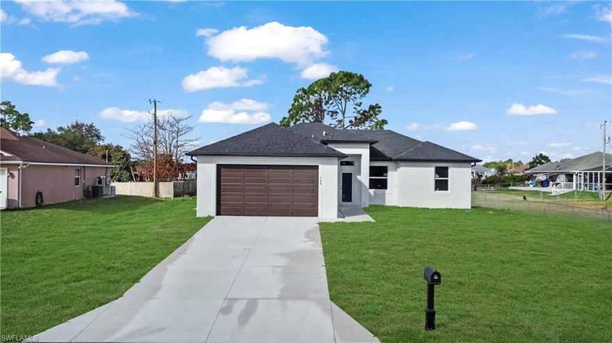 Brand new construction in a quiet Lehigh Acres neighborhood! This modern home offers 3 bedrooms, 2 bathrooms, and a 2-car garage with 1,357 sq. ft. of living space. The open-concept floor plan features high ceilings, large porcelain tile flooring, and a bright living area perfect for everyday living and entertaining. The kitchen includes modern cabinetry, quartz countertops, stainless steel appliances, and a center island overlooking the living space. The spacious primary suite features dual sinks and a large walk-in shower. Enjoy outdoor living with a covered lanai and private backyard space. Conveniently located near schools, shopping, and major roadways. Perfect for first-time buyers, investors, or anyone looking for a move-in ready new home.