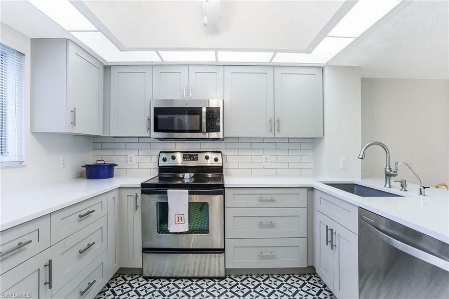 Presenting this beautifully improved condominium with gorgeous lake views in the peaceful, pet-friendly community of Naples Bath and Tennis. Electric storm shutters on most windows and proximity to parking are but a few of the attributes of this first-floor home. The seller's selections for the improved kitchen are spot on with today's current trends. Offered furnished with a few exclusions, this condominium is move-in ready. Naples Bath and Tennis is within a short distance to shopping/dining and offers lively options for biking, jogging and dog walking. Spoonbill Lane has its own heated pool and spa included in the monthly fees. Naples Bath and Tennis Club is minutes away from the white sands of the Gulf of Mexico beaches.