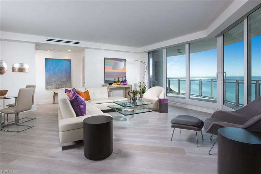 Offering a transitional design with modern flair, this stunning 11th floor residence can only be outdone by its spectacular panoramic Gulf views. Enter through the simplistic yet elegant foyer and be immediately drawn through the floor to ceiling glass to the wrap around open balcony. Sophisticated styling and sleek finishes are found throughout and include, smoke grey French wide plank floors, oversized shaker baseboards and trim, single pane doors and glass built-ins. An exquisite master and en-suite are connected through a fogged glass sliding barn door, where inside you will find honed marble mosaic tile, Lacava free standing soaking tub, glass encased shower and Ceasarstone countertops. The Brighton also offers first class amenities such as lap pool, spa, fitness area and three guest suites while still having access to all Pelican Bay and Bay Colony is renowned for.