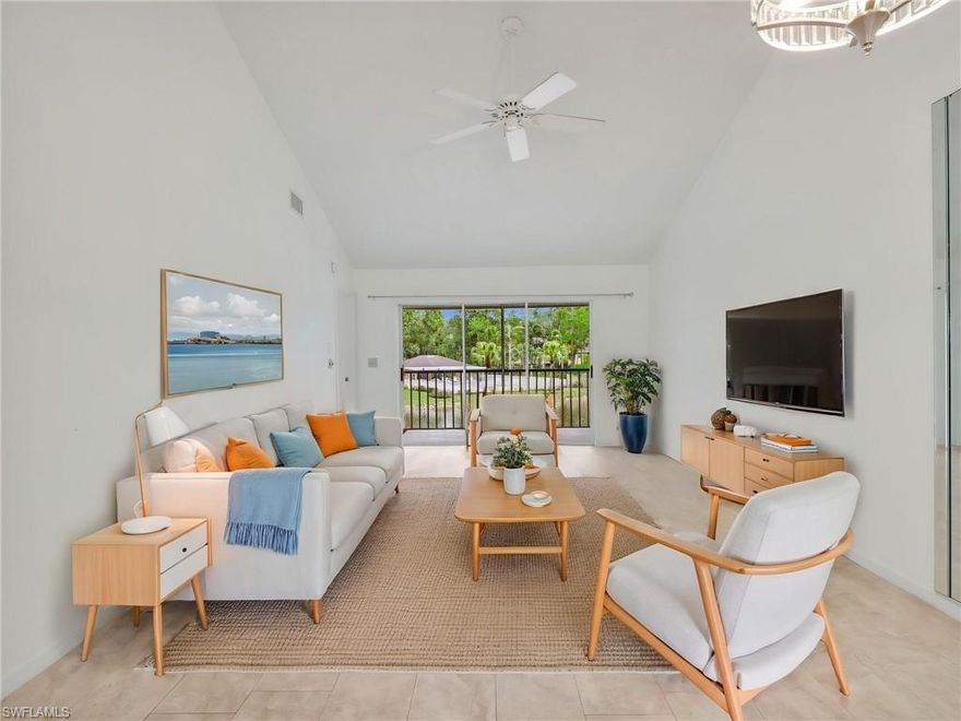 One or more photo(s) has been virtually staged, AI generated or rendered.  This beautifully maintained 2 bedroom, 2 bathroom second floor end unit offers peaceful lake and clubhouse views in one of Naples’ most convenient locations. This light and bright residence features tile flooring throughout, creating a clean and cohesive feel, along with newer appliances that make everyday living easy and efficient. The thoughtfully designed layout includes an eating area within the kitchen as well as an additional dining space within the main living area, providing flexibility for both casual meals and entertaining. The primary bedroom offers a spacious retreat with a large walk in closet, while the primary bathroom features a walk in shower for added comfort and convenience. Enjoy the Florida lifestyle from your screened in lanai overlooking the lake and clubhouse, the perfect setting for morning coffee or evening relaxation. Major updates have already been taken care of, including a roof replacement in 2018 and HVAC system installed in 2019, providing peace of mind for years to come. As an end unit, the home benefits from additional natural light and added privacy. One of the standout features is the deeded vehicle storage space located within a gated area, perfect for securely storing a boat or small camper, a rare and valuable convenience in Naples communities. Woodmere Lake Club offers a relaxed setting centered around its scenic lake and community clubhouse, ideal for enjoying the Southwest Florida lifestyle. Residents appreciate the well maintained grounds and the close proximity to everything the area has to offer. Located just minutes from Downtown Naples, you’ll have quick access to world class dining, shopping, beaches, and entertainment