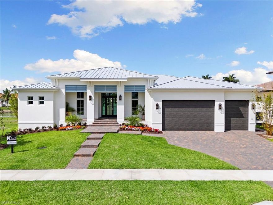 Just completed! New construction waterfront residence on Marco Island with direct, no-bridge boating access and a new seawall. This thoughtfully designed custom home delivers an all-ensuite design, including two primary suites, three bedrooms all with walk-in closets, a den, and a full-size three-car garage, an uncommon feature on Marco Island.  THIS HOME REPRESENTS THE BEST VALUE FOR A NEW WATERFRONT HOME WITH NO BRIDGES TO ACCESS!!

Pocketing sliding doors seamlessly open a light-filled great room to expansive outdoor living, with southwest exposure creating an inviting setting for both daily living and entertaining. The outdoor environment is designed for hosting and entertaining, featuring a custom pool and spa, a clear glass fence to preserve water views, and large outdoor gathering areas with a custom outdoor kitchen.

This professionally curated interior furniture package by Michael Biondo Design presents a cohesive, elevated feel, befitting of this high-end custom home and is available for purchase.  Other features include engineered wood flooring throughout.  The bespoke kitchen includes a Thermador appliance package, mother of pearl backsplash, a dramatic waterfall 10' island, and a butler's pantry with sink and dishwasher and storage galore. 

Designed for buyers seeking the benefits of new construction without the time or uncertainty of building, Kaye Lifestyle Homes, voted Builder of the Year for Collier County and for the State of Florida is proud to present a rare combination of location, quality, and intelligent market positioning, with no truly comparable offerings currently available. Call for your private showing.