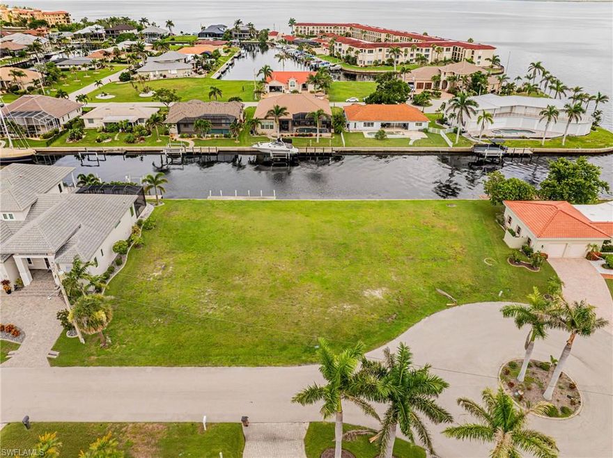 Situated in one of Punta Gorda Isles' most coveted boating locations. Discover the allure of this rare 0.22 acre key lot at the northern tip of Punta Gorda Isles, nestled in the Sailboat Section, boasting breathtaking panoramic views of Charlotte Harbor! This property is a true gem, offering a prime location and views that are unparalleled. With an impressive 100 feet of seawall—far exceeding the typical 80’ or 85’—it provides ample space for more than one dock and lift. Plans already available to build an L-shaped home design which would ensure a perfect harbor view while maintaining privacy in the back living areas. Conveniently located close to shops and restaurants as well as the spectacular Sunseeker Resort. 

All essential soil testing, engineering based on soil tests (no pilings required), surveys, elevation certificate, site plans, architectural, and structural engineering have been completed and available upon request. These are available at an additional cost to the purchaser, offering a convenient way to save time. Don’t miss the opportunity to own this exquisite piece of paradise!