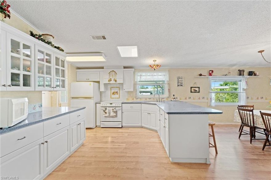 The largest lot available in Riverwood! VERY LOW HOA FEES & DEEDED LAND OWNERSHIP! This property feels more like a home than most. With nearly 1,800 sq feet of living and one of the largest lots in all of Riverwood this is not an opportunity to pass up. A pristinely kept home with an expansive lanai area this residence offers move-in-readiness while also giving ample opportunity for customization & remodeling. Riverwood is a boater's neighborhood with a community ramp that grants access to the Gulf via keycard. Riverwood also offers an optional pool membership & is only a short drive to the white sand beaches of Marco Island.