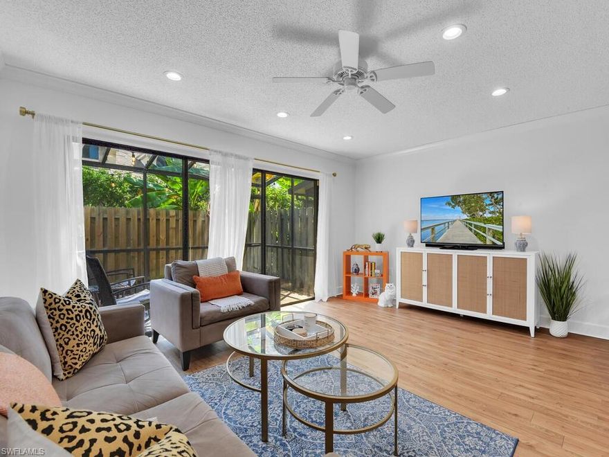 GORGEOUS RENOVATION! This townhome has been tastefully updated with a contemporary flair- completely renovated open concept kitchen (designer soft closing cabinetry w/ pull out shelving, high-end hardware & fixtures, quartz countertop, & beautiful backsplash), luxury vinyl flooring throughout w/ exception to bathrooms (w/ warranty), freshly painted interior, new a/c in 2021, new garage door opener, and flush mounted LED lighting on first floor. The HOA replaced the roof in 2018. Perfect home for seasonal or annual SWFL living that is situated in a deeded community that offers 2 community pools (one being just 50 ft from the front door) and a fantastic location- within walking distance to the shopping/dining/nightlife at MERCATO, easy access to I-75 & US 41, and LESS THAN 2 miles from the beach!