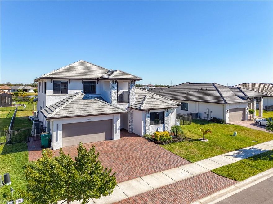 Discover elevated living in this one-of-a-kind Harbour model, masterfully designed with modern elegance, custom finishes, and a seamless indoor–outdoor flow. Offering 5 bedrooms, 4 bathrooms, and 3,522 sq ft, this 2023-built residence sits on a rare 9,583 sq ft fully fenced in lakefront lot in the prestigious Maple Ridge community of Ave Maria. Inside, the home impresses with multiple sets of upgraded French doors from the dining room, living room, and master suite. Each opening to the outdoor oasis. Luxurious upgrades include impact windows and doors, designer bathrooms, premium finishes, and enhanced architectural details throughout. The chef-inspired kitchen features upgraded cabinetry, stone counters, a custom wine rack, and a built-in entertainment center, creating a modern and highly functional gathering space. Step outside to your private retreat. A custom luxury pool, spacious sun deck, and sweeping lake views set the tone for resort-style living and elegant entertaining.
Residents of Maple Ridge enjoy a multi-million-dollar clubhouse with a resort-style pool, fitness center, dog park, billiards room, pickleball, tennis, playgrounds, walking trails, and vibrant community programming. Additionally, Ave Maria offes water park with slides and splash zones, town center shopping and dining, community parks, sports fields, golf opportunities, bike/jog paths, top-rated schools, and a lively small-town atmosphere unlike anywhere else in Southwest Florida.