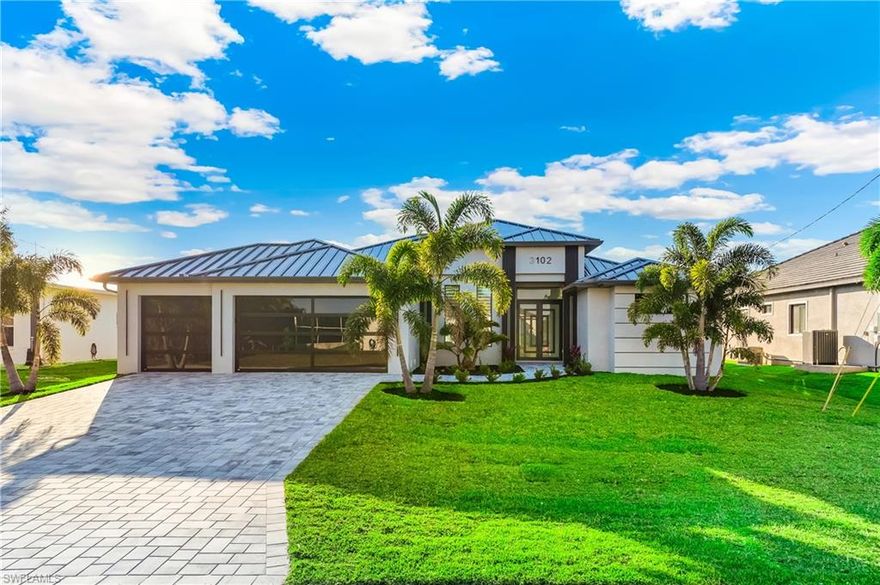 Welcome to a stunning new construction home perfectly positioned in one of Southwest Cape Coral’s most desirable waterfront neighborhoods.

This beautifully designed residence offers modern coastal living at its finest, situated on a serene Gulf access canal with picturesque water views and direct access for kayaking, paddleboarding, and fishing right from your backyard. Enjoy breathtaking sunsets and peaceful mornings from your private West exposure lanai overlooking the water.

Inside, the home features a bright, open-concept floor plan with soaring ceilings, expansive impact-resistant windows, and high-end finishes throughout. The chef-inspired kitchen boasts quartz countertops, custom cabinetry, stainless steel appliances, and a spacious island ideal for entertaining. The split-bedroom layout provides privacy and comfort, while the primary suite offers a spa-like retreat with dual vanities, a walk-in shower, and generous closet space.

Step outside to your private outdoor oasis featuring a sparkling screened-in pool and luxurious hot tub. Whether hosting guests or unwinding after a long day, this outdoor living space is designed for year-round enjoyment. The covered lanai provides ample space for dining and lounging while taking in tranquil canal views.

Located in the heart of Southwest Cape Coral, this home is just minutes from neighborhood parks, boat ramps, waterfront dining, golf courses, and top-rated schools. Enjoy convenient access to shopping, grocery stores, and everyday essentials along nearby Pine Island Road and Cape Coral Parkway. Pristine Gulf beaches, including those of Sanibel and Fort Myers Beach, are just a short drive away.

Experience the best of Florida waterfront living in this exceptional new construction home—where luxury, location, and lifestyle come together.