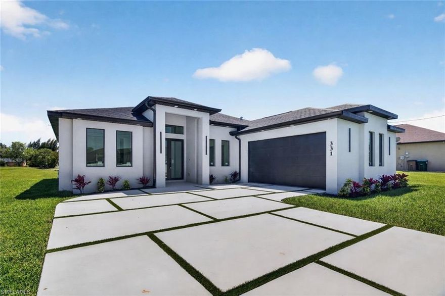 Welcome to clean, modern living without breaking the bank.

This NEW CONSTRUCTION home is designed to impress from the very first glance, offering outstanding curb appeal with a custom driveway, thoughtfully curated landscaping, and a color palette that blends beautifully with the natural surroundings. The property features city water and sewer and is situated on a freshwater canal, delivering both convenience and lifestyle.

Step inside and experience elevated design with 12’6” high ceilings, 8’ interior doors, and a level 5 smooth wall finish, complemented by a refined interior lighting design that enhances every space. The open-concept layout creates a bright and spacious feel, perfect for both everyday living and entertaining.

A versatile flex space offers the option for a formal dining area, home office, or playroom.

The kitchen is a true focal point, featuring sleek European-style cabinetry, stainless steel appliances, a wine cooler, and a spacious pantry—designed for both functionality and style.

The primary suite serves as a private retreat, thoughtfully designed for comfort and relaxation. Enjoy a spa-like experience with a soaking tub, walk-in shower, dual vanities with a large anti-fog touch mirror, a linen closet, and two walk-in closets.

This home offers 3 bedrooms and 3 full bathrooms, including a convenient bathroom with direct outdoor access—ideal for future pool plans or seamless indoor-outdoor living.

Step outside to your covered lanai, the perfect space to relax or entertain while enjoying peaceful canal views. The freshwater canal provides a serene backdrop—ideal for fishing or simply embracing the natural beauty of Southwest Florida living.

Additional highlights include a spacious laundry room and epoxy-finished garage flooring for a clean, polished look.