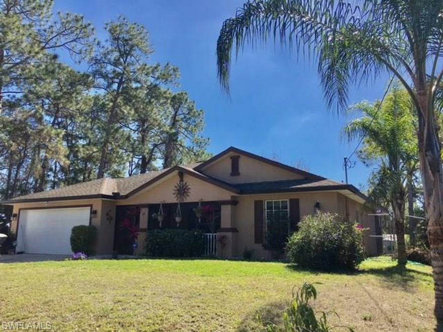 GREAT LOCATION!! Beautiful 3/2 home is located in Lehigh Acres, 7 minutes to I75, less than 5 minutes to Publix grocery store other convenient shopping, & Buckingham Park. Wooded lot next door and unique parcel to the rear of the property it's the perfect mix of privacy and neighborhood. Large Master bath with dual sinks and walk-in slate tiled shower, ample closet & storage space throughout, built in home office/ work area, Stainless steel appliances, tile, wood & wood laminate flooring, both front and back screened lanai, hot tub, and large back yard PLENTY of room for a pool!