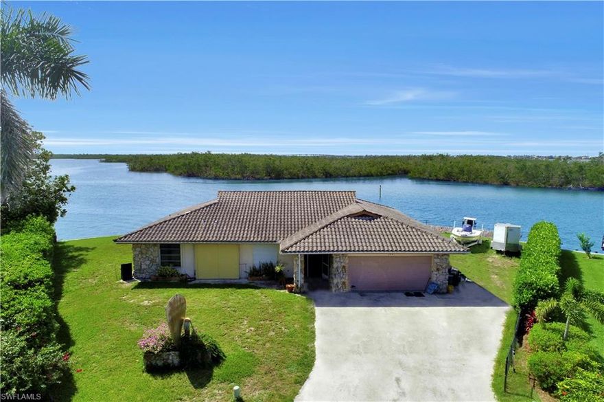 Rarely available bayfront tip lot on Isles of Capri that includes a 2 acre island!  Long views into mangrove bays and inlets with Southeast exposure. Quick, deep, direct access to the Gulf of Mexico and the 10,000 islands, home is ripe for major remodel or you can build a home to maximize your views all the way to the Marco River.  View the aerial tour to see both the home and the island!
