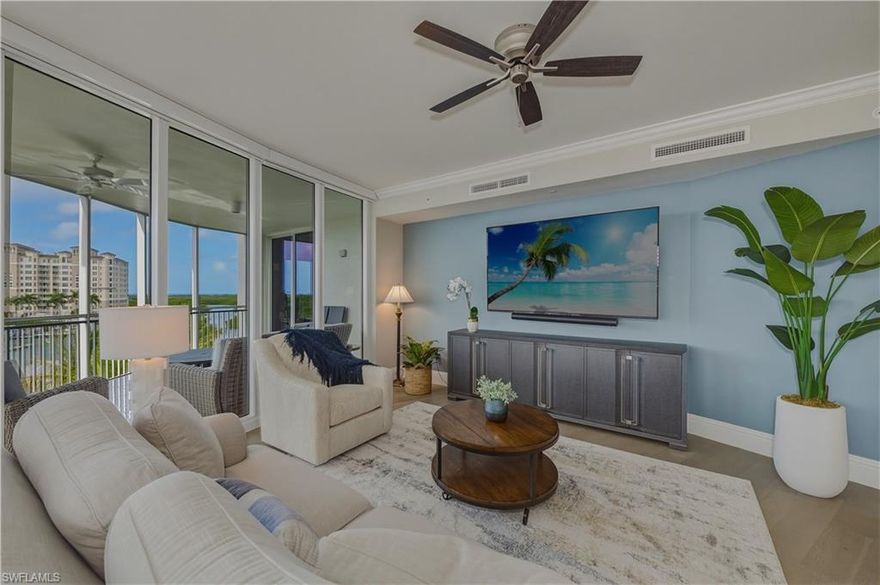 Exceptional end-unit residence in the newer tower at Aqua at Pelican Isle, ideally positioned with southwest exposure and beautiful views of the marina, and inland waterways out front, plus golf course views to the rear. With a wall of windows and doors natural light is in abundance.   Two separate lanais with sliding doors, allows this residence to capture both sunrise and sunsets along with refreshing coastal breezes. One of only a few with built in grille on the lanai.

The spacious floorplan offers 3 bedrooms plus a large den and features two distinct living areas, creating flexibility for entertaining and comfortable everyday living. Natural light pours in from the additional side windows unique to an end residence, enhancing the open feel throughout.

The gourmet kitchen is thoughtfully appointed with a natural gas cooktop, built-in ice machine, oversized island, and generous cabinetry—ideal for both casual dining and hosting. The primary suite is a private retreat with an exceptionally large spa-style bath and expansive closets. Guest bedrooms provide comfort and privacy for family and visitors.

Aqua is a boutique luxury building with only 32 residences in the second tower and an unmatched amenity package designed to elevate your lifestyle. Enjoy direct Gulf access through Wiggins Pass from the private marina, a state-of-the-art fitness center, spa, resort-style waterfront pool, theater, game room, sky lounge, and sunset terrace. Additional highlights include a golf simulator, putting green, dog park, multiple guest suites,  concierge services and 24/7 security.