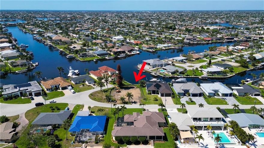 DIRECT SAILBOAT access lot with Seawall , Western exposure and stunning views of San Carlos Canal. This oversized lot was recently cleared and is the perfect land for your custom dream home. Very popular neighborhood - surrounded by multimillion dollar homes ! Watch dolphins play in the canal and enjoy the very short, bridge-free boat ride to the river. Don't miss out on this great opportunity ! Drone video attached.