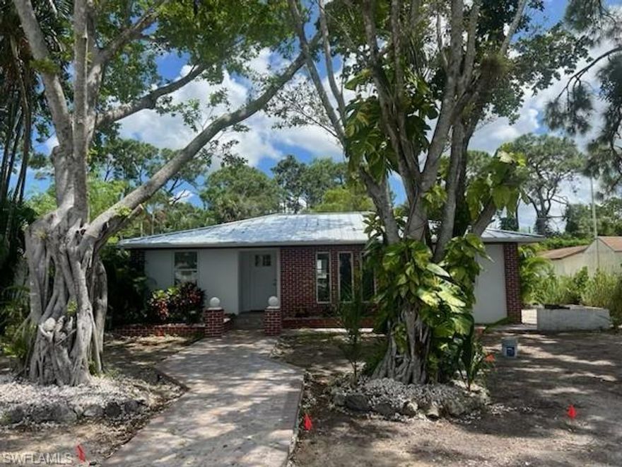 Discover this unmissable gem. This newly renovated inviting bungalow style home in the the heart of Bonita Springs boasts an abundance of natural light giving it a warm cottage feel. You will feel safe with new Hurricane Impact windows and doors along with a NEW old Florida style metal roof. Upon arrival you will be welcomed by a newly paved walkway, unique entrance and Mature trees all on a dead end street to keep traffic at a minimum. This charming home keeps getting better as it also includes an air conditioned, detached living space, alongside an extra-large storage shed. All in an enormous backyard enclosed by a privacy fence. Inside you will find a modern updated kitchen with new stainless steel appliances, quartz countertops all complimented by a lovely backsplash that is easy to maintain. The newly remodeled bathrooms have been adorned with sleek fixtures, modern shower spaces and vanities for that continued modern-chic style. This home offers luxury vinyl plank flooring throughout. Neutral tones make it easy to add you own personal touch and style to make it your home. This jewel is conveniently situated near stunning beaches and the downtown Riverside Park area comprised of a vast array of bars, trendy restaurants, quaint shops and an amphitheater that hosts fun outside festivals, flea markets, concerts and other family friendly activities. A short walk or drive and you are in Shangri-La.....this iconic area of historic downtown Bonita showcases some of the oldest trees in SWFL. Conveniently positioned between Naples and Ft. Myers, it allows for easy access to I-75, US 41 and RSW International Airport. All the great activities that Lee and Collier County offer are at your finger tips: beaches, nature, shopping, dining, and much more. Fur Babies welcome (some breed restrictions). Just around the corner is a wonderful Dog Park for your pets enjoyment. This perfectly nestled home offers fantastic character and uniqueness.