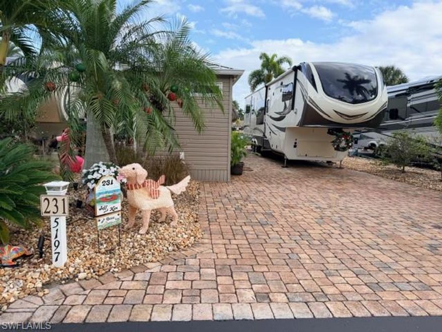 This beautiful lakefront lot is very unique in that it can host a Class A, Class C, or a 5th Wheel. The lot features an amazing 12’ x 24’ tiki hut, complete with hurricane lights, twin ceiling fans, side spotlights, and privacy drop-down shades. You can enjoy your favorite TV programs under the tiki on the Samsung 65” that can be raised or lowered as desired for optimum viewing pleasure while still allowing spectacular views of the lake. If you like to cook out, you won’t be disappointed with the large custom-built outdoor kitchen featuring a 32” stainless steel grill, refrigerator, sink, and an abundance of granite counter space and storage. Guests can sit at the raised 8’ granite bar top complete with four stools. But let’s not forget the 8’x15’ Amazon casita, completely finished with LVP flooring, an acrylic shower, toilet, and sink along with additional storage. It has a mini-split to always maintain the inside temperature at a desired comfort level as well as a washer/dryer hook-up and on-demand hot water heater. The lot comes complete with an irrigation system, tropical trees, and additional landscaping for added privacy. (Note: all projects were permitted/built to code).  Stop in to see all the features this lakefront lot has to offer.