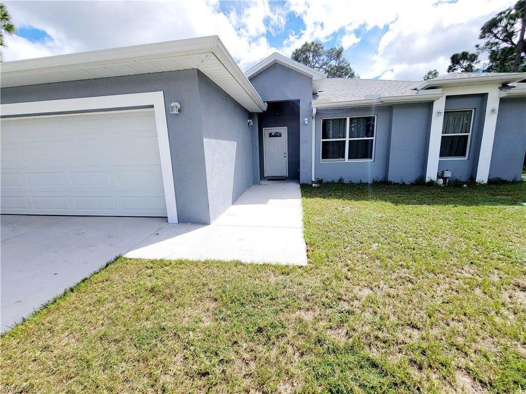 Photo of 1138 Jaguar BLVD, LEHIGH ACRES, FL 33974 (MLS # 2025018300)