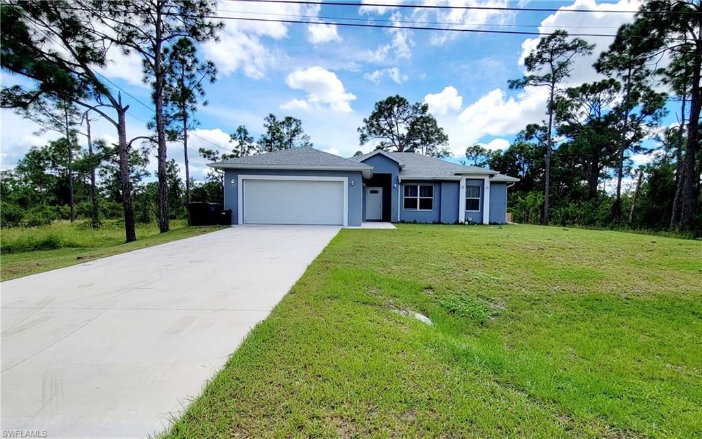Photo of 1138 Jaguar BLVD, LEHIGH ACRES, FL 33974 (MLS # 2025018300)