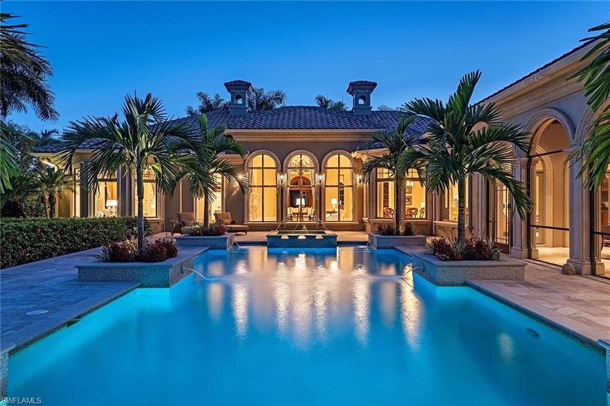 Spectacular panoramic double fairway views abound on the 4th fairway of the Estuary golf course from this luxury estate. This well-appointed home boasts 6,170 square feet of air-conditioned living space including five bedrooms, five full baths plus two half baths, study and an exercise room. Features include a 1,100-bottle temperature-controlled wine cellar, a wood-paneled library with coffered ceiling, a family room with vaulted ceilings, custom crafted wood entertainment center and natural gas-powered generator. An inviting gourmet kitchen is fully equipped with 2 dishwashers, 2 Sub-Zero refrigerator/freezer units, plus a multitude of top-of-the-line appliances. The expansive screened outdoor entertainment area includes a tongue and groove coffered ceiling, outdoor kitchen and bar, two TVs and wide-open views. A world of luxury awaits you in the completely renovated Grey Oaks country club community minutes from world-class shopping, beaches and dining.