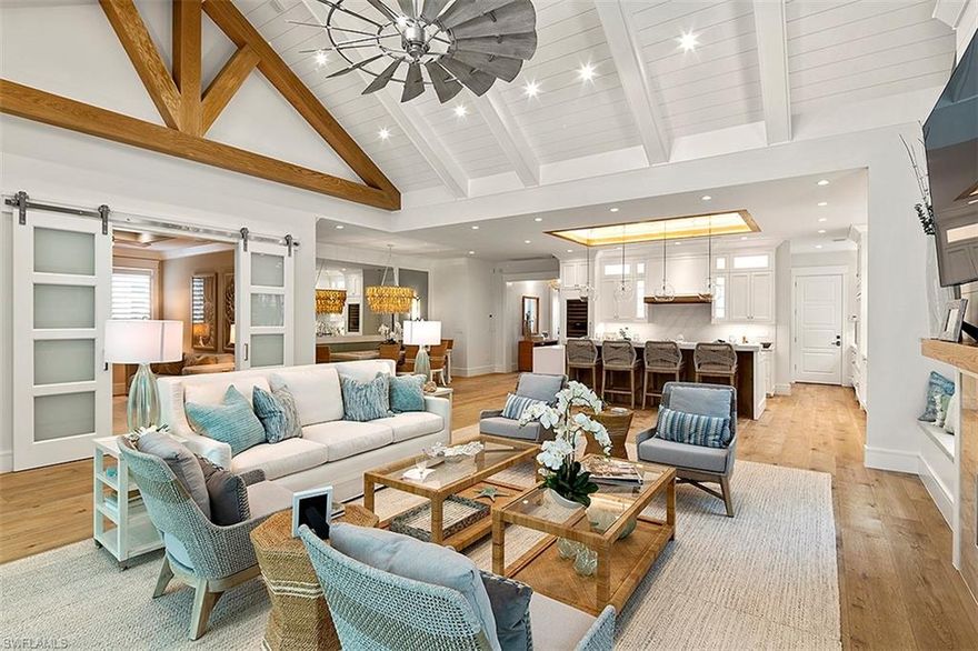 Stunning Amelia III plan (Lot 28), luxuriously appointed & FURNISHED by Koastal Design Group. Single-story main house & private entry guest cottage above the garage. Coastal chic design elements include a natural color palette, European white oak flooring throughout, organic textures & reflective finishes. Stunning canal & mangrove preserve views, PRIVATE BOAT SLIP INCLUDED & optional membership to the Naples Grande Golf Club.Custom Ruffino cabinetry, decorative mill work, custom built-ins & gourmet kitchen featuring Wolf/Subzero appliances. Spacious covered terrace with electronic roll down screens, outdoor fireplace & grilling station. Masterfully designed pool & and spa area with shellstone decking surround. CBS construction,standing seam aluminum roof,natural gas feed & built to accommodate a home generator system. Mangrove Bay is nestled along the Gordon River in Old Naples & adjacent to Baker Park, the Naples Dog Park, 5th Avenue Shopping & Dining & the Gulf Beaches. Mangrove Bay offers a luxury resident Wellness Center with state-of the art- fitness room, resident lounge, ground level kayak/paddle board storage and private boat ramp.