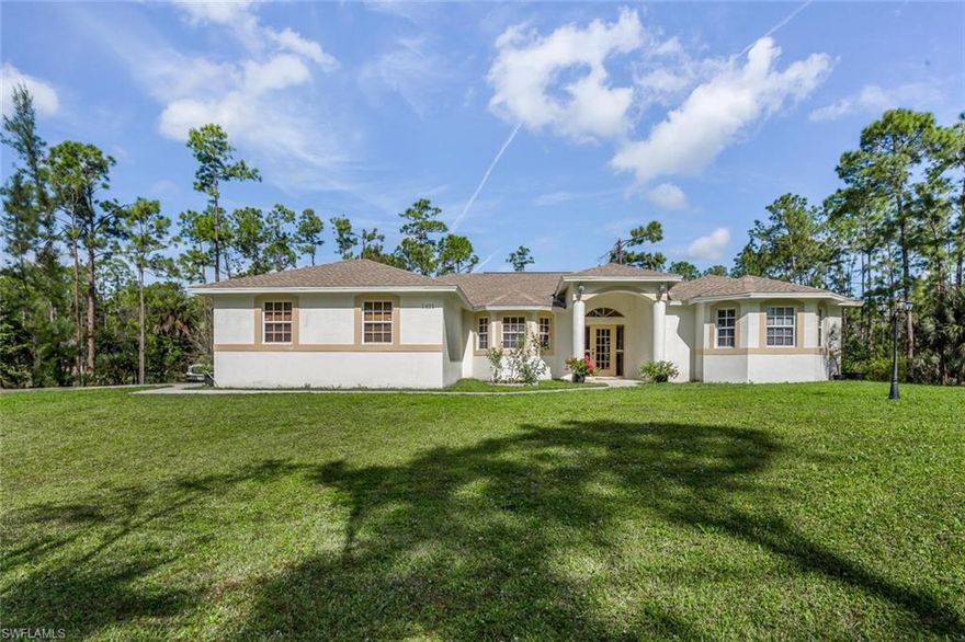 Your private and peaceful retreat awaits! Pride of ownership is evident in this well maintained spacious custom built home on 2.5 acres of cleared land, filled with fruit trees. The tiled throughout home features 3 bedrooms and 3 baths. Split floor plan with an open concept. Large picture window in family room allows for natural light. Enjoy coffee outdoors at the open terrace, overlooking acres of well manicured land.  Large kitchen features stainless steel appliances, granite countertops and pantry.  Master Bedroom and en-suite with separate vanities and walk in shower. A craftsman's dream, this property includes a fully equipped carpentry workshop and utility outdoor storage shed. Located near the New Publix plaza, close to schools, shopping and restaurants. Don't miss out on the opportunity to own this amazing estate home with it's many added features!