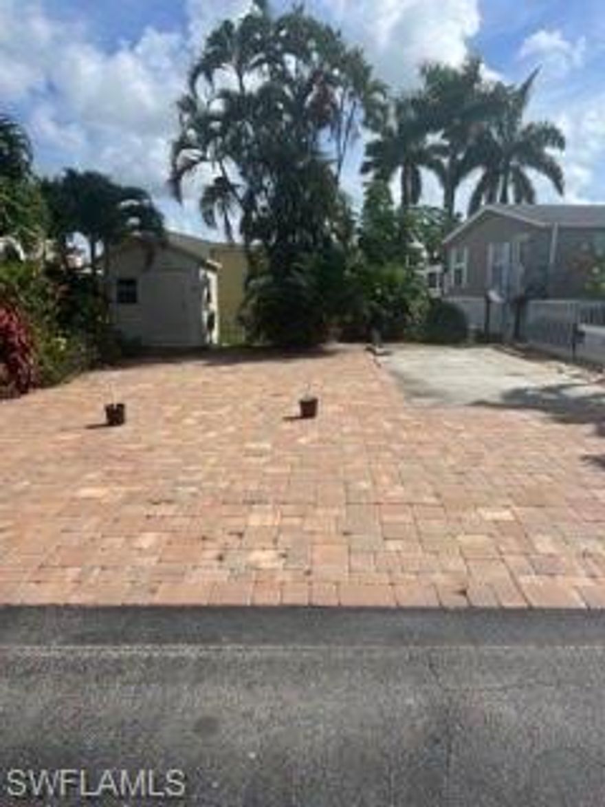 Come claim your piece of paradise! This rarely available lot is located in a 55+ community and is ready for your mobile home or RV. Comes equipped with pavers and a storage shed as well as connections for your RV. America Outdoors is a gated community where homeowners own the land with LOW fees and GULF ACCESS via boat ramp! Enjoy the Florida lifestyle in this active community!