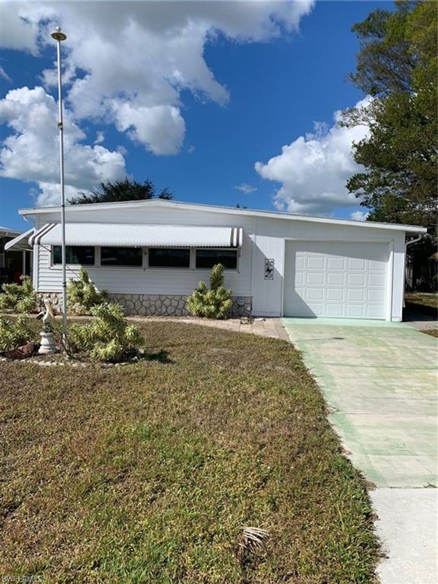 Welcome to Imperial Harbor in beautiful Bonita Springs. Located in a friendly, 55 and over, deed restricted community with NO HOA Fees but does have a voluntary Civic Association membership for $100/yr. YOU OWN THE LAND/LOT. This manufactured home presents a fantastic opportunity for those seeking a relaxed and convenient Florida lifestyle.  Purchase a Imperial Harbor Club social membership for $1500, yearly renewal for $350/yr after that. Harbor Club membership then allows access to the community pool, shuffleboard, bocce ball, workout room, clubhouse, and other activities. Additional storage for RV's, boats, trailers, etc. for $250/yr through Harbor Club. This home is nestled in a great location near shopping, dining, and a short distance from the world-renowned beaches and historic downtown Bonita Springs. Priced to sell! Property is being sold "As Is".  Sold with the furnishings.