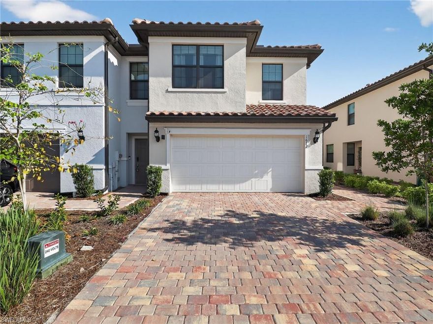 Welcome to Sawgrass at Coral Lakes, where modern luxury meets the ultimate Florida lifestyle! This stunning 3-bedroom, 2.5-bath townhouse features the popular Rowan floor plan, offering a spacious open-concept design and a rare 2-car attached garage. Constructed with durable concrete block on both levels, this home is built for peace of mind with hurricane impact-resistant windows and doors throughout. The gourmet kitchen is a chef’s dream, boasting quartz countertops, a large social island, and a premium Whirlpool® stainless steel appliance package. Retreat upstairs to the expansive owner’s suite featuring a dual-sink vanity and walk-in closet, alongside a convenient second-floor laundry room. Step outside to your private covered brick-paver lanai to enjoy tranquil landscaped views. As a resident of this premier gated community, you’ll enjoy world-class amenities including two resort-style pools, a fitness center, tennis, and more.