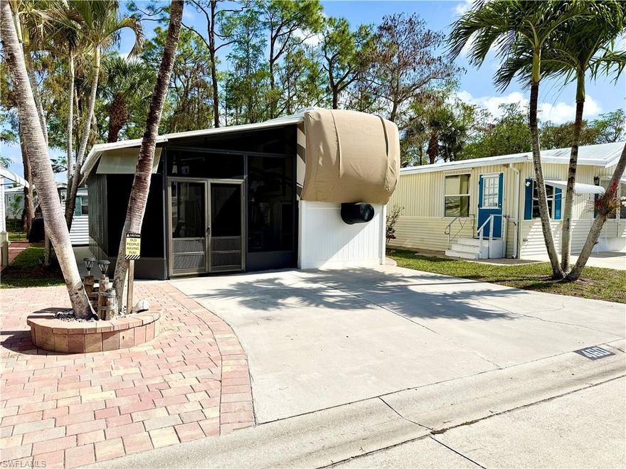 RV with huge lanai & shed with washer/dryer on a 35x70 lot in NAPLES, FL—YOU OWN THE LAND! This is a great opportunity at an affordable price. Located within an active 55+ community that is not a Co-Op or leased land, the purchase includes the following: a 2014 1Br/1Ba RV, spacious screened lanai with TV and storage, rear shed (with washer/dryer, refrigerator, & toilet), patio pavers, scenic rear view (facing N), whole-unit water filtration system, 2024 hot water tank, king-size bed, and entire roof reseal (2026). The comfortable unit features a well-appointed spacious kitchen, large shower (with seat) in bathroom, freezer chest in closet, washer/dryer hookup (in unit), ample storage, and updated laminate flooring throughout. This location is truly ideal for relaxing and entertaining. Plus, you will be happily impressed with the outstanding level of maintenance. Maximizing your opportunity of economically owning land and a very attractive RV with lanai in Naples, Florida, the HOA fee ($898. per quarter) is exceptionally reasonable. That fee covers many of your needs: the advantage of a gated community, water, sewer, lawn care, basic cable, trash, recycling, and community amenities. Community amenities include 2 pools with spas, bocce, pickleball, pétanque, tennis, shuffleboard, billiards, ping pong, a library, clubhouse, 2 dog parks (pet allowance–1 pet, 40lb. max.), and a nature trail. On top of this, there is an extremely active events calendar.