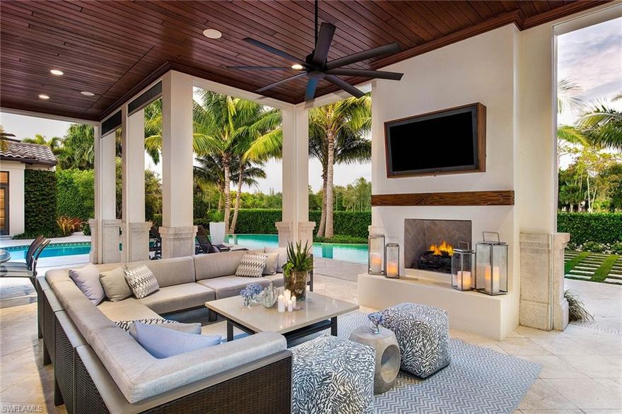 Stunning Santa Barbara-style architecture and timeless elegance define this fabulous residence nestled within the exclusive Estuary at Grey Oaks. This sophisticated four-bedroom, four-and-a-half-bath home has been renovated to reflect a contemporary blend of traditional and modern finishes. A chef’s delight, the well-appointed kitchen offers a generous island and casual seating areas and is open to the family room accented by a stunning linear fireplace and pocketing sliding doors to the lanai. Perfect for entertaining, the outdoor space features a gorgeous sitting area accented by cozy fireplace, an outdoor kitchen, and lovely picturesque pool and spa, all set among a tropical and lush landscape overlooking fairway vistas. Residents can enjoy impressive amenities available with memberships, including three championship golf courses, a fitness facility, a tennis center with eight Har-Tru tennis courts, a lagoon-style swimming pool, 18-hole putting course and two clubhouses offering casual and gourmet dining.