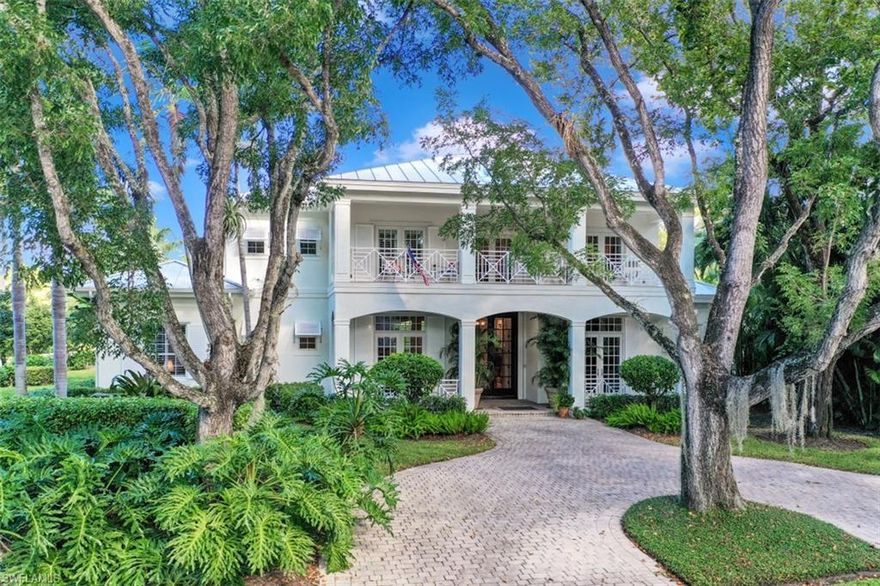 Ideally positioned just 2 blocks to the beach on beautiful tree lined 2nd Avenue North, this captivating residence offers classic West Indies style on a spacious .34 acre lot.   Perfectly designed for multi-generational, and work from home living, this great property contains 6 bedroom suites, 12 foot ceilings, plus exceptional wood finishes and marble & wood flooring throughout.  The upstairs level includes a spacious living area with library & morning kitchen, plus 3 guest suites and covered balconies overlooking both the pool and lovely 2nd Avenue. The generous first floor master suite, features a spa like bath, and gorgeous pool views. Other great features include a 31X 21 resort style pool with waterfall and spa, outdoor kitchen, & 3 car garage with alley access. This is an exceptional home situated on spacious and private grounds in the most picturesque Old Naples setting, just steps to the beach and all that Old Naples has to offer.