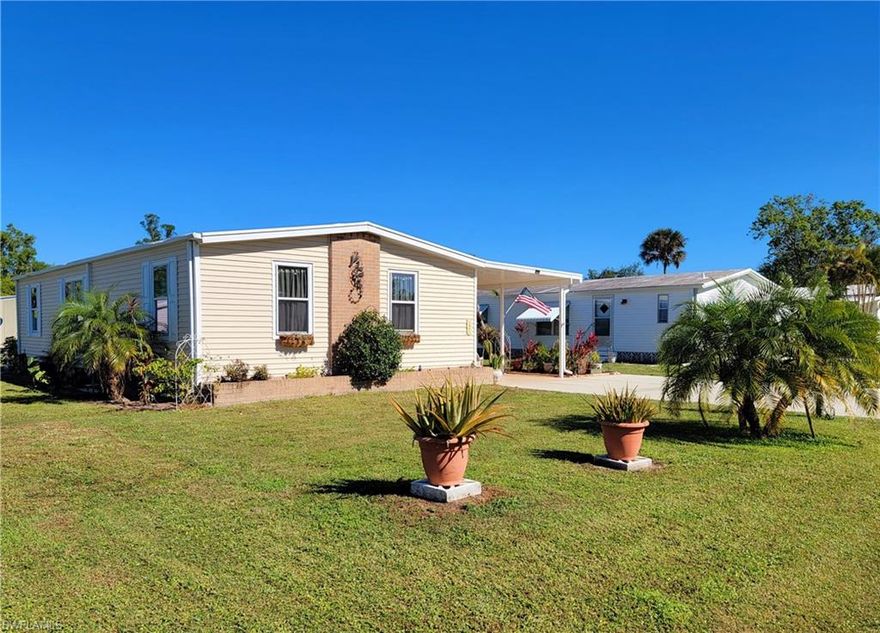 Welcome to West Wind Estates 55+ community, where you own the land and pets are welcome! This great 2 bedrooms /2 bath home offers bright and spacious living with higher ceilings and plenty of natural light. The home is equipped with newer kitchen appliances and an indoor laundry room. Bonus rooms include an oversized screened lanai and storage space. Outdoor bonus highlights include an attached carport and double-wide driveway for extra parking, plus a backyard semi-private patio space. This 55+ community requires ONE occupant 55 or older and all other occupants must be 18 years of age or older. West Winds is an active and friendly community with various social opportunities. The Clubhouse includes the community pool, full kitchen, billiards & darts, hobby room, library, tennis, shuffleboard and more. The location of the neighborhood is less than a mile from a new Publix shopping center, which includes an Urgent Care, Nail Salon, Mail & Shipping Store and more.  Additional shopping and variety of restaurants are 5 minutes away, downtown Naples/5th Avenue. Marco Island, Goodland and Isles of Capri are each a 20 minute drive or less!