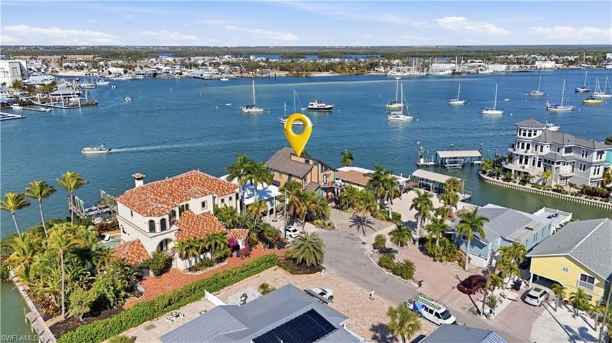 Panoramic BAYFRONT living ideally positioned in the heart of the Pier District / Times Square. AMAZING Rental Location! REMODELED in 2023-24, this stunning BAYFRONT POOL home showcases modern coastal living with iconic Mid-Century Modern architectural influences, honoring the design roots of Fort Myers Beach. Enjoy the ultimate walkable island lifestyle with no need to search for parking—yet with the rare convenience of being able to quickly get on and off Estero Island when needed. Designed for entertaining and effortless everyday living, the open floor plan features an efficient kitchen with abundant storage and BIG CHILL appliances as its focal point. Expansive windows flood the home with natural light while framing sweeping BAY views—enjoy watching boats gliding by, dolphins playing and shimmering evening light displays across the BAY. From the upper deck, enjoy panoramic views including the 4th of July fireworks show, while the covered deck allows you to savor waterfront living even on rainy evenings. The décor is fun, colorful, and mood-elevating, perfectly complementing the coastal setting. The primary suite offers breathtaking BAY views, creating a private owner’s sanctuary, while the spacious loft provides the perfect “grandkids’ escape” or flexible bonus space. The 2 Guest rooms compliment the  Decor throughout the home. Additional highlights include covered parking for two vehicles, along with ample space to accommodate up to four guest vehicles. Plus a true dedicated laundry room featuring a commercial-grade washer and dryer. Outdoor living is exceptional with a new heated pool & spa, multiple balconies, and expansive waterfront vistas. The pool is heated by propane gas, using a 250-gallon tank. The 
This HIGH PERFOMANCE RENTAL LOCATION, offers exceptional investment potential alongside unforgettable personal enjoyment. This timeless Coastal Classic delivers unmatched walkability, vibrant island energy, strong rental appeal, and the very best of elevated bayfront living on Fort Myers Beach.