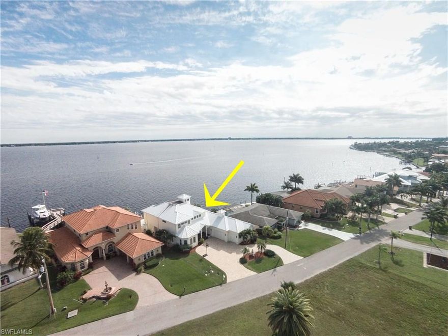 RIVERFRONT, "Florida Style" Custom home w/ Cupola that sheds light & detail to the soaring Great Rm ceiling. Built in Stereo System w/ Speakers in 8 interior & exterior locations. Custom Detail, Woodwork, Built Ins, Wide Crown Molding 7 1/2"  Baseboards, 3 1/2 " fluted trim and Rosettes through out. Back of the home is wall of glass offers Breathtaking views. Solar heated Vanishing Edge pool w/computerized System. Separate Heated Spa w/Custom Honey Onyx Waterfall Pavers on pool deck,Lanai, Captain's Deck & Circular Driveway. 40 feet rear screened Porch w/ built in cooktop, 2 fans, Cypress ceiling. Second story Verandah has Porcelain tiles and has covered and uncovered areas with Cypress Ceiling. Hardee Plank siding & metal roof makes for easy maintenance Gourmet Kitchen w/ tons of storage,Cabinetry plus 2 pantry's, Custom Grade granite, 11 foot Breakfast Bar. Master Suite 26x16, Large Tile, Tray ceiling with lighting 10 ft., Private Verandah, You have to feel spoiled w/ this Master Bath. 2 custom Maple 6ft vanity's, Quartz counters, 11 ft walk through tile shower, built in seats, multiple heads & sprays, glass tile detail, etched glass windows. OS Master Closet w/built in Cabinetry