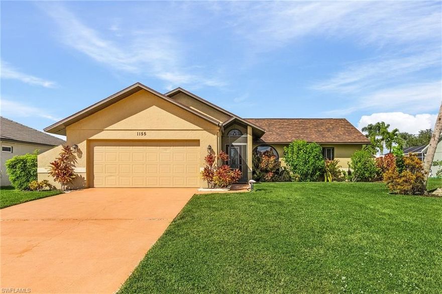 Location really does make all the difference—and this home puts you right where you want to be. Just across the street from Lake Finisterre, Cape Coral’s largest Gulf-access lake, you’ll enjoy the feel of a waterfront neighborhood surrounded by stunning million-dollar homes.

Step inside and you’ll immediately notice how open, bright, and welcoming the space feels. With tile flooring throughout the main living areas, the home flows effortlessly from room to room. The kitchen is truly the heart of the home, featuring granite countertops, stainless steel appliances, a butcher block island, and a breakfast bar that naturally becomes the gathering spot for family and friends.

The dining area opens up to your own private backyard retreat, with sliders on two sides that create that perfect indoor-outdoor lifestyle Florida is known for. Whether you’re hosting a dinner party or just enjoying a quiet evening, this space was made for it. The fully fenced backyard offers both privacy and peace of mind for pets, while the large avocado tree adds character—and the perfect excuse to make fresh guacamole at home.

The primary suite feels like a relaxing escape, complete with warm wood flooring and a unique bathroom featuring an atrium garden just outside the shower—bringing a little bit of nature into your daily routine. The second bathroom offers a deep soaking tub with jets, ideal for unwinding after a long day.

You’ll also appreciate the practical upgrades and peace of mind: a new roof in 2023, impact windows, accordion shutters, and no flood zone designation—with no water damage from Hurricane Ian. The AC was replaced in 2016, and the washer and dryer are conveniently located in the garage along with the air handler for easy access.

Located just minutes from Cape Coral Parkway and Veterans Parkway, you’re close to everything—shopping, dining, and even within walking distance to the Cape Coral Library.

This is more than just a house—it’s a place to settle in, feel secure, and enjoy the Florida lifestyle to the fullest. Schedule your private showing today.