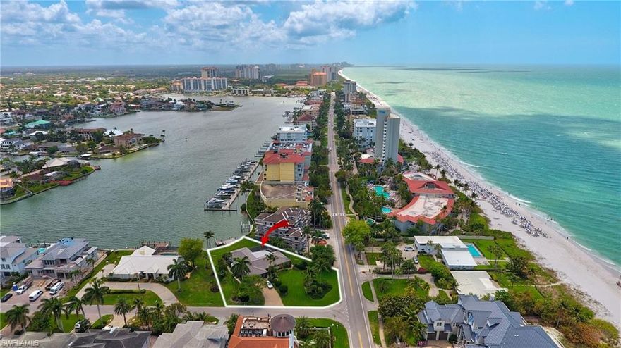 Rare opportunity! Nearly 1/2 an acre on Gulf Shore Drive directly across from the beach on Vanderbilt Lagoon! Move in, refurbish, or tear down and or build!