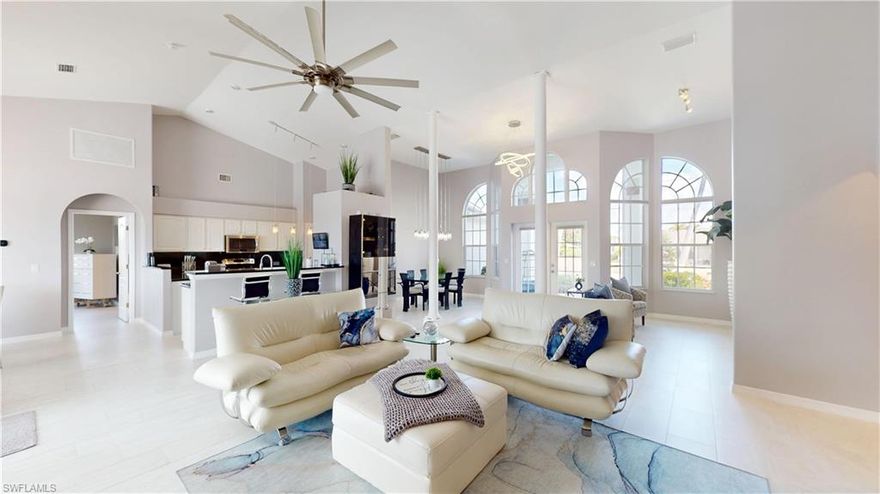 NO FLOOD ZONE, NO FLOOD INSURANCE AND NO HOA
Experience waterfront living at its finest in this magnificent modern canal-front home. Built in 2003 and beautifully remodeled, this 4-bedroom, 2-bath residence showcases sleek contemporary finishes and thoughtful upgrades throughout.
Tile flooring flows seamlessly through the home, complementing the updated kitchen featuring granite countertops, custom cabinetry, stainless steel appliances, and an additional refrigerator in the laundry room for added convenience. The home offers a large open great room with impressive 12–14 foot ceilings, creating a bright and airy living space perfect for entertaining, while the bedrooms feature comfortable 9-foot ceilings. Modern lighting enhances every space, and the living room offers a stylish wall-mounted electric fireplace as a warm and inviting focal point.

The spacious primary suite is a private retreat, complete with its own wall-mounted electric fireplace, two walk-in closets, and a luxurious en-suite bath boasting dual modern sinks with granite countertops, updated lighting, a jetted soaking tub, and a separate standalone shower.

Situated on an oversized triple lot with approximately 120 feet of seawall, this property offers exceptional outdoor space and privacy. Sliding glass doors open to the screened lanai overlooking a wide, serene canal with direct access to all seven lakes, perfect for boating, kayaking, and enjoying Southwest Florida’s waterfront lifestyle. Boaters will appreciate the private dock and 7,000-pound boat lift, making time on the water effortless.

The outdoor living area also features landscape and dock lighting for beautiful evening ambiance, as well as an above-ground hot tub—perfect for relaxing after a day on the water.

Additional highlights include a spacious three-car garage and accordion shutters throughout for added peace of mind and storm protection.

This home is being sold turnkey, including beautiful modern furnishings and televisions in the living room, eat-in kitchen, and primary suite.

Move right in and start enjoying the ultimate Florida waterfront lifestyle.