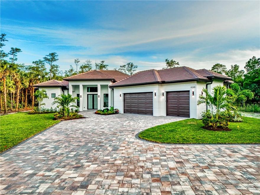 Welcome to luxury living in the heart of Naples, Florida. Privately tucked away and situated on 2.5 private acres, this stunning new construction estate offers the ideal combination of modern elegance, comfort, and privacy. Featuring 4 spacious bedrooms + den, 3 beautifully designed bathrooms, and an open-concept floor plan with soaring ceilings and abundant natural light throughout, every detail of this home was thoughtfully crafted for elevated living. Step inside to discover expansive living spaces, oversized porcelain tile flooring, designer lighting, and a spectacular chef-inspired kitchen complete with sleek custom cabinetry, high-end finishes, oversized waterfall island, and premium stainless steel appliances. The luxurious screened-in pool and spa area offers your own private resort experience, surrounded by tranquil views and endless space to relax, host guests, and create unforgettable memories year-round. Built for both beauty and peace of mind, this home also features impact-resistant windows and doors, providing enhanced security, energy efficiency, and storm protection. With a spacious driveway, oversized garage, modern architecture, and unmatched attention to detail, this exceptional Naples property delivers quality living and an experience like no other!!!